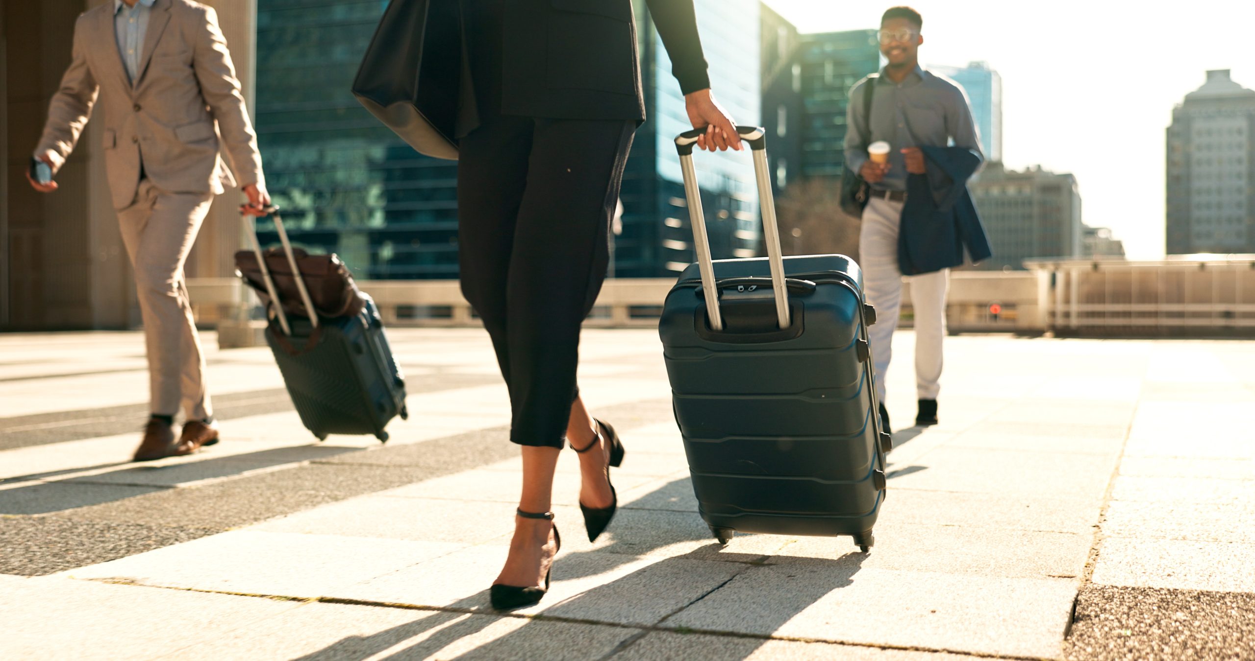 Business, legs and luggage for travel in city with corporate people walking to hotel, airport or business opportunity. Professional woman or men feet and steps with suitcase outdoor in career journey